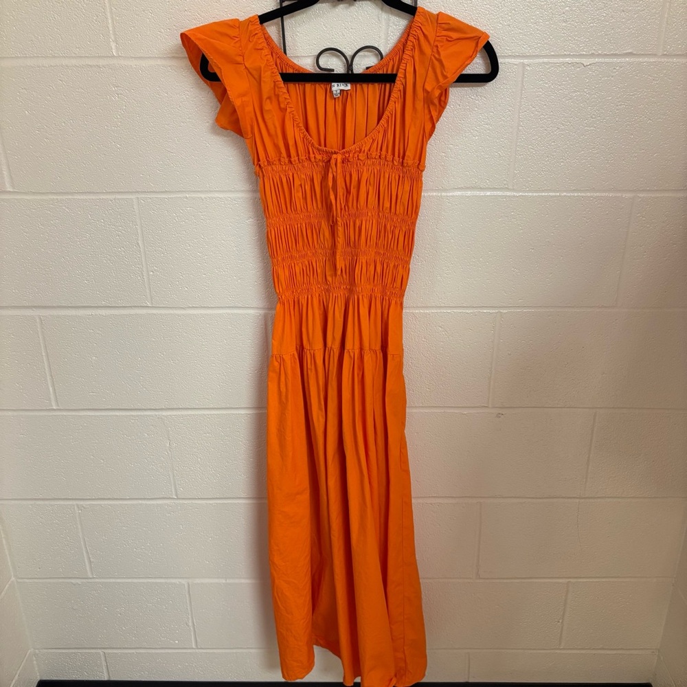 Orange maxi dress with tie detail and ruched bodice